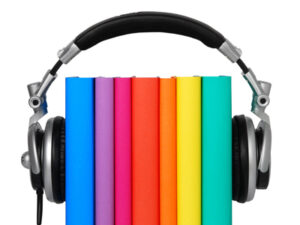 colorful books with headsets holding them